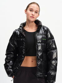 Gloss Puffer in Black – front view unzipped over a crop top