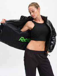 Gloss Puffer in Black – held open to show interior graphic