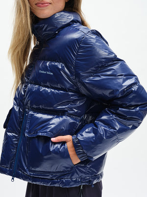 Gloss Puffer in Moonlight – side close-up with hand in pocket