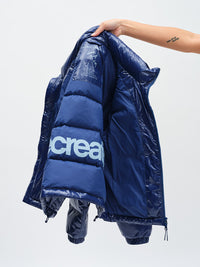 Gloss Puffer in Moonlight – held up to show back graphic