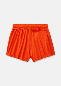 a person wearing an orange tank top and orange shorts