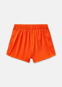 a person wearing an orange tank top and orange shorts