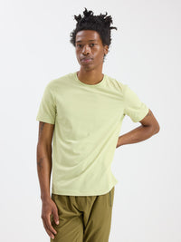 Model wearing GridTek Breezy Shortsleeve in Light Green, ultra-breathable performance fabric for active pursuits.