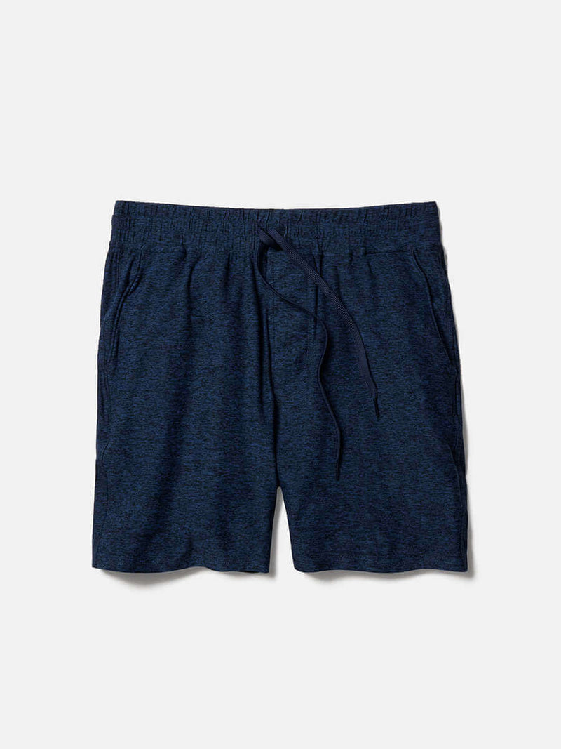 Flat lay of CloudKnit 7" Short in Navy, featuring a comfort fit adjustable waistband and side slit pockets.