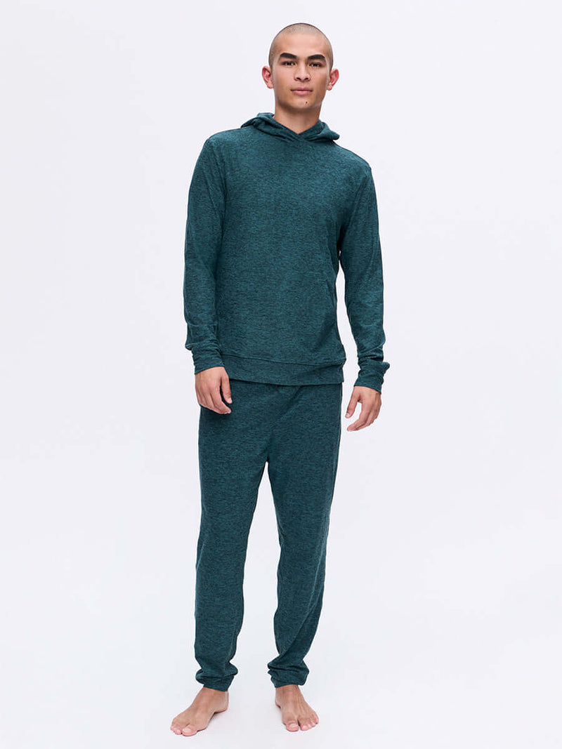 Model standing in CloudKnit Hoodie in Dark Teal, featuring a lightweight and breathable fabric.