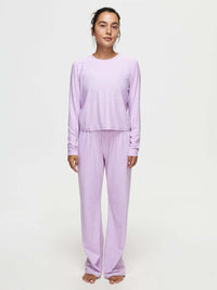 Model standing in CloudKnit Boxy Longsleeve in Lavender, cropped length with relaxed fit, paired with matching pants.