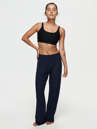 Model standing in CloudKnit Wide Leg Pant in Navy, featuring a relaxed fit and comfortable waistband.