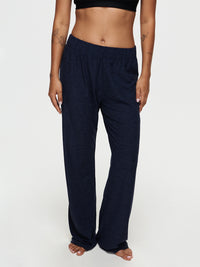 Model standing in CloudKnit Wide Leg Pant in Navy, featuring a relaxed fit for maximum comfort.