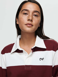 Model wearing a Club Polo, a yarn-dyed rugby polo with ribbed cuffs and hand-embroidered OV signature.