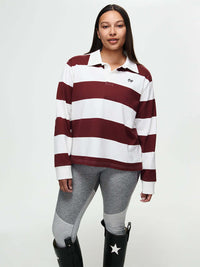 Model with the Club Polo, a yarn-dyed rugby polo with stripes and ribbed cuffs, for fall layering.