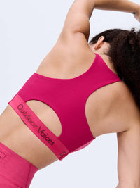 Back view of Doing Things Bra in Magenta, featuring mesh backing and Outdoor Voices logo.