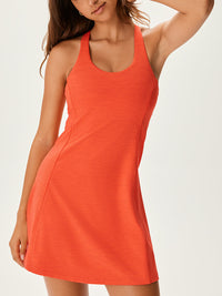 Model wearing Doing Things Dress in Bright Orange, featuring a sporty design and breathable TechSweat fabric.