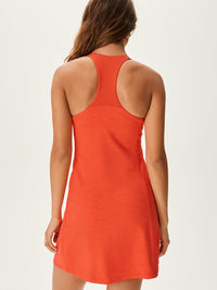 Back view of Doing Things Dress in Bright Orange, showing racerback design and breathable TechSweat fabric.