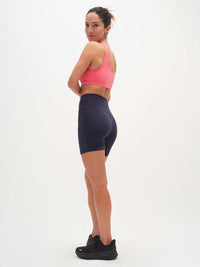 Model from the back wearing Double Dip Bra in Cotton Candy, with the double scoop neckline and wide shoulder straps.