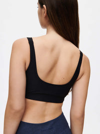 Back view of Double Time Bra in Black, featuring medium support and double scoop design.