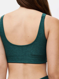 Back view of Double Time Bra in Teal, showing the smooth Textured Compression fabric and scoop back design.