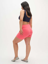 Model seen from the back wearing Echo 5.5" Short in Cotton Candy, highlighting the tall waistband and supportive stretch.