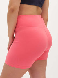 Model showing back view of Echo 5.5" Short in Cotton Candy, high-rise design with tall waistband for support.