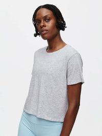 Model wearing Everyday Shortsleeve in Light Grey, relaxed fit with slight crop, styled for everyday wear.