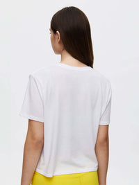 Back view of Everyday Shortsleeve in White, displaying its relaxed fit and cropped length.