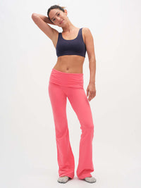Model standing in relaxed pose wearing Flared Legging in Cotton Candy, featuring an extra-tall waistband.