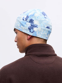 Back view of Frosted Beanie in Light Blue, featuring exclusive Elf Garden print with pine trees and daisies.