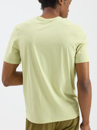 Back view of GridTek Breezy Shortsleeve in Light Green, ultra-breathable performance mesh fabric.
