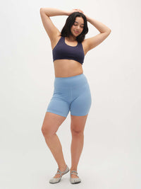 Model posing in Echo 5.5" Short in Cotton Candy, featuring a tall waistband and supportive stretch.