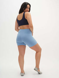 Model wearing Echo 5.5" Short in Cotton Candy, high rise fit with tall waistband for gentle hold.