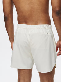Back view of High Stride 5" Short with Pockets in Cream, featuring a hidden phone pocket.