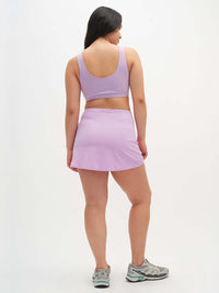 Back view of model wearing LightSpeed Minimal 3" Skort in Lilac with built-in shorts liner, for active days.