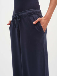 Close-up view of Malibu Sweatpant in Navy, featuring side pockets and an elastic waistband with drawcord.