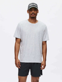 Model wearing Zephyr 5" Short in Black, with a custom-fit drawstring waist and lightweight performance fabric.
