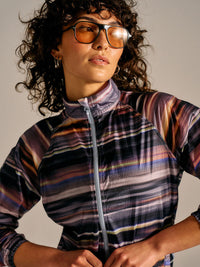 Model wearing Jog Jacket in multicolor stripes, with quick-drying fabric and full-zip design for active pursuits.