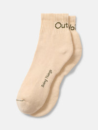 Flat lay of OV Rec Ankle Sock in Cream, featuring ribbed ankle and soft fabric for everyday wear.