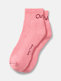 Flat lay of OV Rec Ankle Sock in Pink, featuring a ribbed ankle and cushioned bottom for casual exercise.
