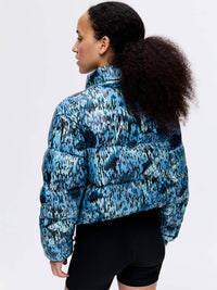 Back view of Rainy Floral Puff in blue and green, with puffy texture and high collar design.