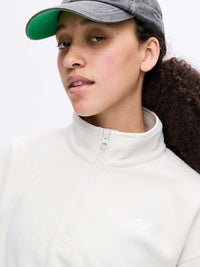 Model wearing RecFleece 1/4 Zip in Light Gray, featuring a front ¼ zip and soft fleece fabric.