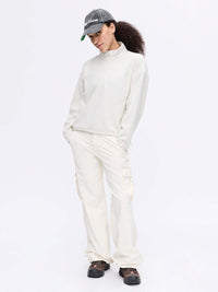 Model standing in casual pose wearing RecFleece 1/4 Zip in light gray, featuring a front ¼ zip and cozy midlayer fabric.