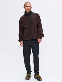 Model wearing RecFleece Relaxed Full Zip in Dark Brown, featuring a full zip front and contrast shoulder panels.