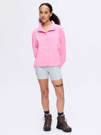 Model standing in RecFleece Snap Jacket in Pink, featuring a snap front and roomy fit.