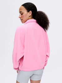 Back view of RecFleece Snap Jacket in Pink, featuring dolman sleeves for a roomy fit.