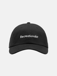 Front view of Recreationalist Hat in Black with embroidered text, a classic adjustable cap for everyday wear.