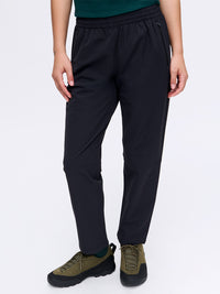 Model standing in RecTrek 26" Pant in black, featuring a comfortable elastic waistband and front pockets.