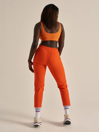 Back view of RecTrek 26" Pant in Bright Orange, with the elastic waistband for comfort.