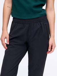 Model wearing RecTrek 26" Pant in Black with pull-on design and elastic waistband, ready for everyday activities.