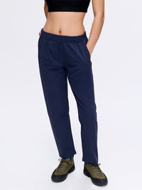 Model wearing RecTrek 26" Pant in Navy with a custom-fit drawstring and two front pockets, ready for recreation.