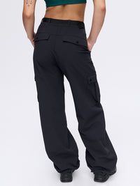 Back view of RecTrek Cargo Pant in Black, with four utility pockets and cinchable hems.