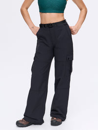 Model in black RecTrek Cargo Pant with adjustable belted waistband and utility pockets, ideal for active adventures.