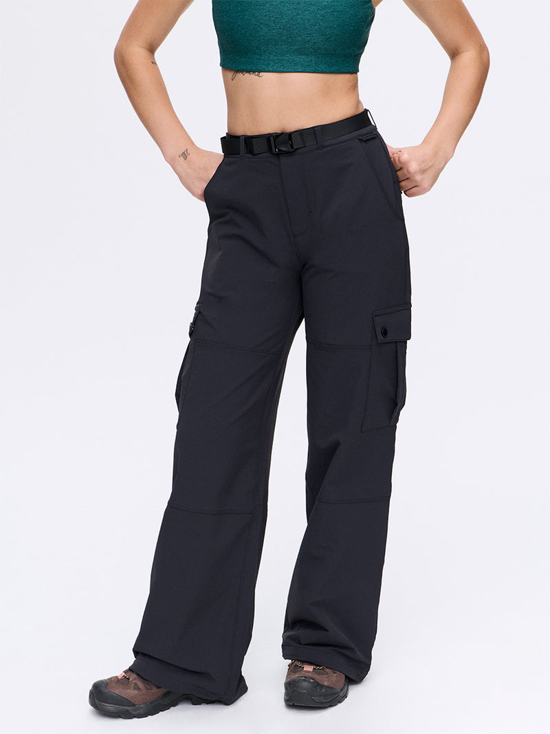 Model in black RecTrek Cargo Pant with adjustable belted waistband and utility pockets, ideal for active adventures.